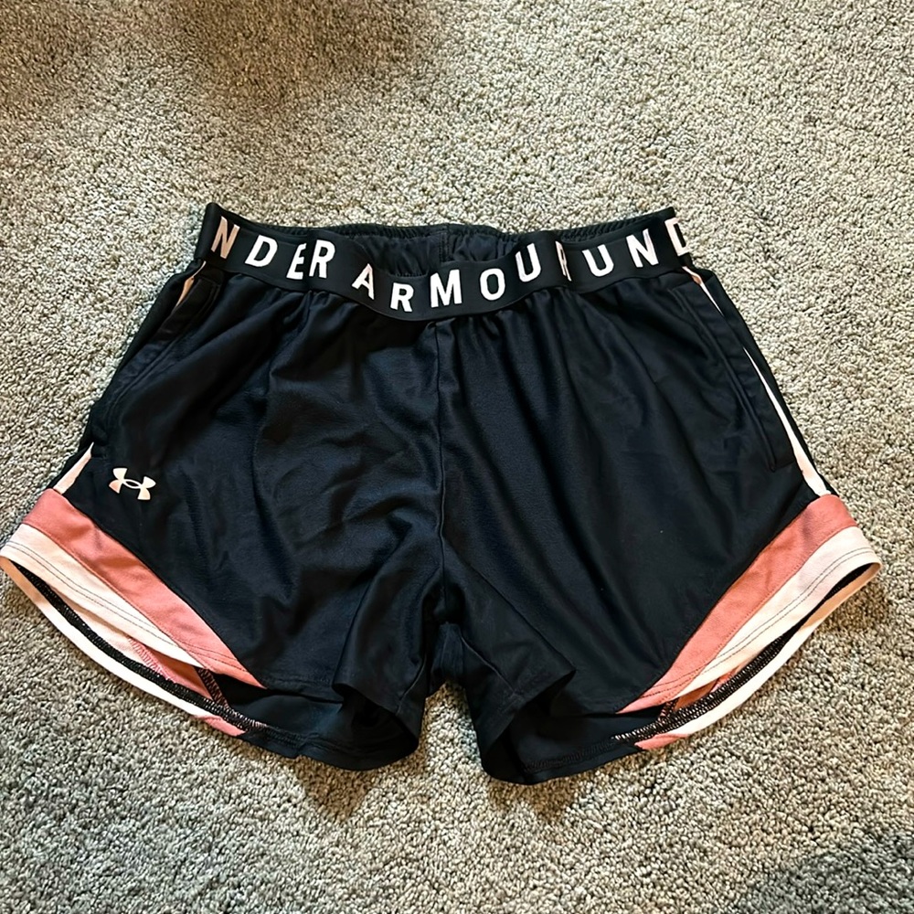Black under armor shorts with pink/dark sunset bottom design.